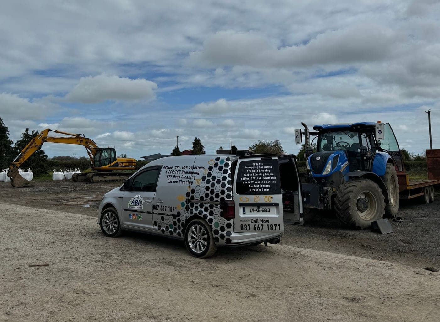 ABI's branded van on a building site next to a digger and a tractor